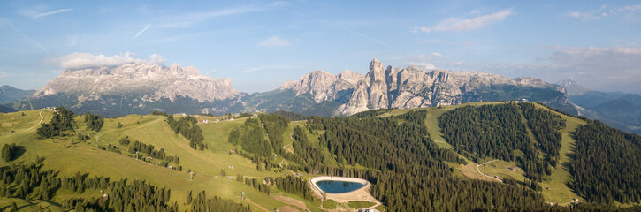 Fototapeta na wymiar Amazing aerial landscape at Dolomites. View on Gardenaccia and Sella massif. Alta Badia, Sud Tirol, Italy