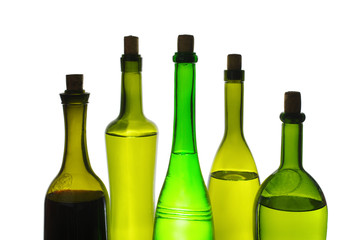 Colored wine bottles on white. Isolated on white