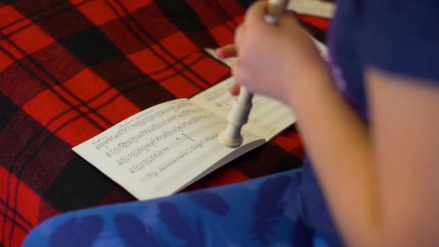 Hands of Girl Practicing Flute