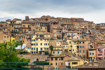 Fototapeta na wymiar View on Siena city from street Via del Sole. Italy