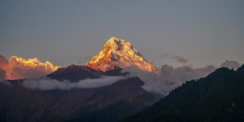 Snow Peak of Annapurna Mountain at Sunrise among Clouds in the Himalayas in Nepal