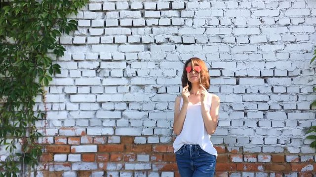 Young happy hipster girl laugh and freaking out. Sunny day.
