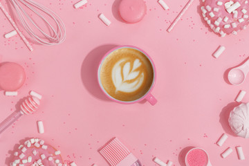 Kitchenware and tools, pastry and sweets on a pink background. Top view. Copy space.