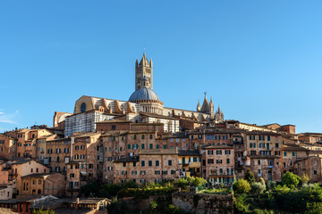 View on Siena with Dome and Bell Tower of Siena Cathedral or Duomo di Siena from Basilica di San Domenico. Italy