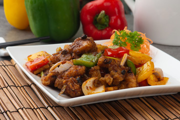 stir-fried chinese style grouper fish fillet with herbs and black pepper