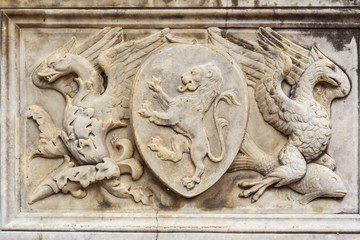 Coat of arms etail of Fonte Gaia is monumental fountain in Piazza del Campo in Siena. Italy