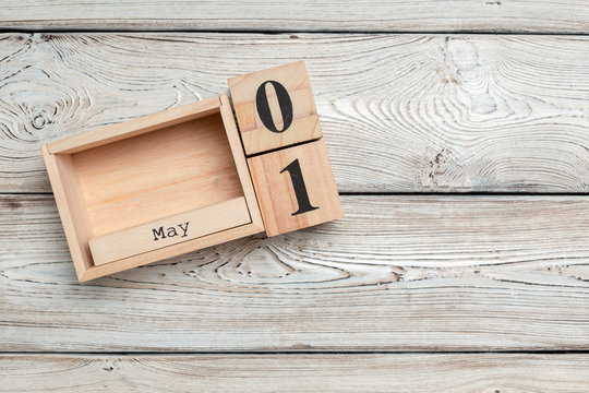 May 1st. Image of may 1 wooden color calendar on wooden background. Spring day, empty space for text. International Workers' Day