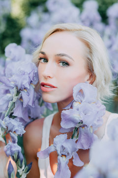 young girl in iris flowers