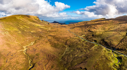 Aerial view of the mountain pass road on the top of Quiraing from Uig to Staffin - Isle of Skye, Scotland