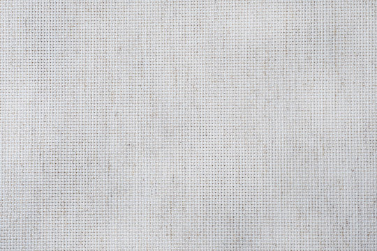 Fabric canvas for cross stitch crafts. Texture of cotton fabric.