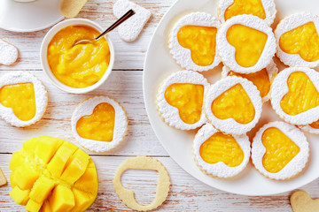 Heart shaped linzer cookies on a plate