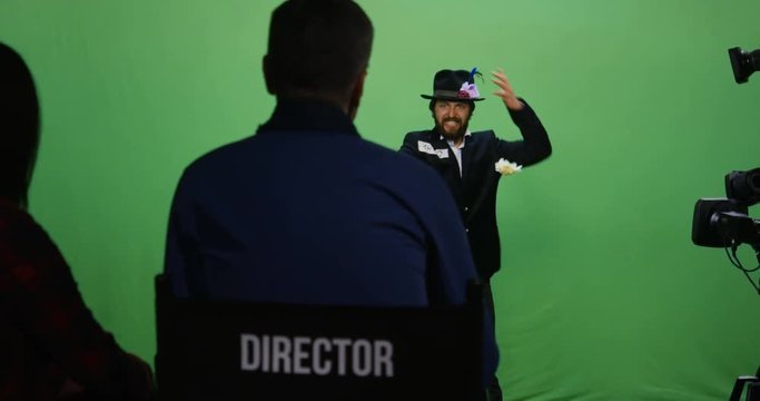 Slow motion shot of a director watching an actor performing an angry character
