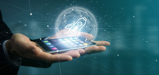 Businessman holding a  start up rocket on a sphere 3d rendering