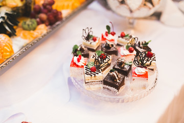 Different kinds of baked sweets on a buffet