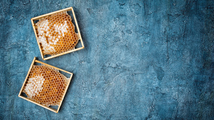 Natural product honeycomb in wooden frames as organic ingredient for healthy nutrition