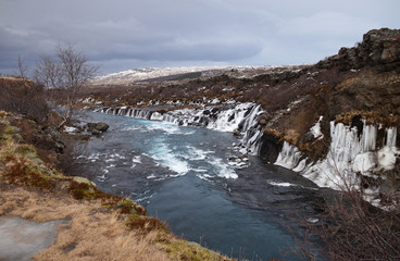 Glacial river of Iceland from blue water amid lava fields