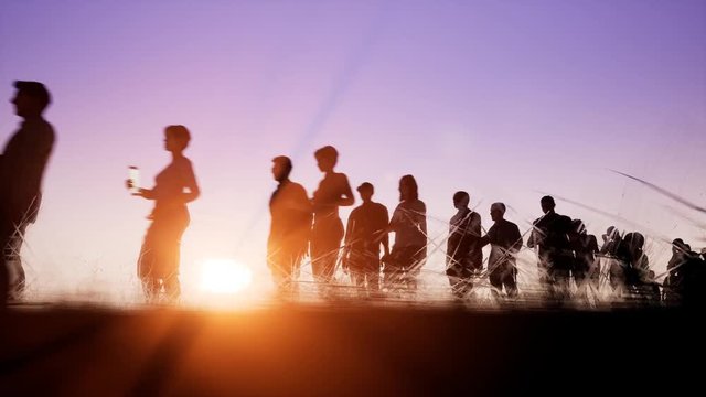 The queue of people on the background of a sunset