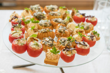 Catering for party. Close up of sandwiches, appetizers and fruit. Snacks in the restaurant