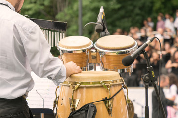 Fototapeta na wymiar Drummer drum set. outdoors. Drummer playing in the park.