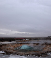 The eruption of the Strokkur geyser in the southwestern part of Iceland in a geothermal area near the river Hvitau