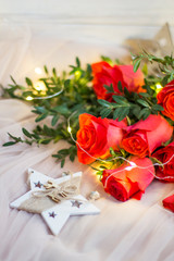 Composition: red roses with boxwood, garlands and star
