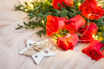 Composition: red roses with boxwood, garlands and star
