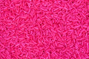 Pink rice from above view for texture backgrounds