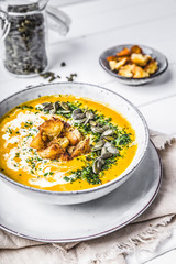 Pumpkin soup with cream,herbs and seeds