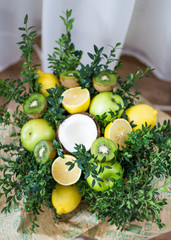 Bouquet of lemons, green apples, coconut, kiwi and boxwood