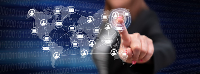 Woman touching a global network technology concept