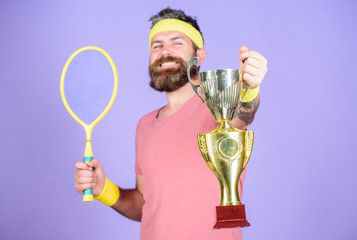 Athlete hipster hold tennis racket and golden goblet. Win tennis game. No player can step on court...