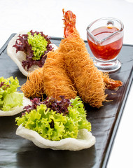 Tiger prawns in kataifi. On white background