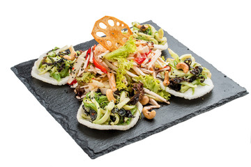 Asian salad with squid and Chinese mushrooms Tsey On a white background