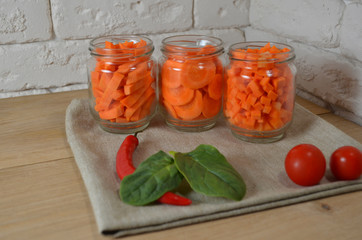 Sliced ​​carrots on a table in a jar