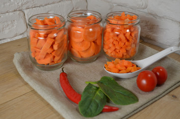 Sliced ​​carrots on a table in a jar