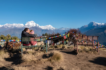 Romantic Couple Enjoying the View of the Himalayas. Two Young People Hike Together in Nepal. Active...