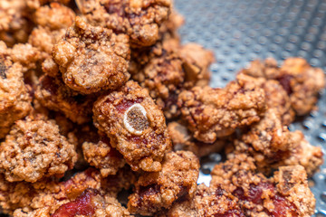 Fresh and delicious Taiwanese deep fried chicken (Salt crispy chicken) in Taiwan's night market, close up.