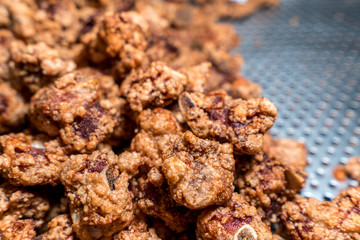 Fresh and delicious Taiwanese deep fried chicken (Salt crispy chicken) in Taiwan's night market, close up.