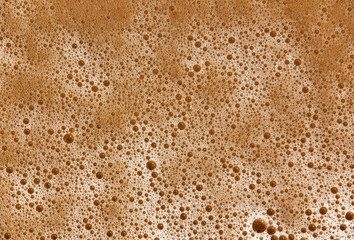 the texture of the foam on the sand