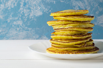 Stack of traditional russian pancakes blini on gray background with copy space. Homemade russian thin pancakes blini. Russian food, russian kitchen