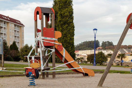 Cordoned off slide in a playground in Cambre Spain Stock Photo | Adobe Stock