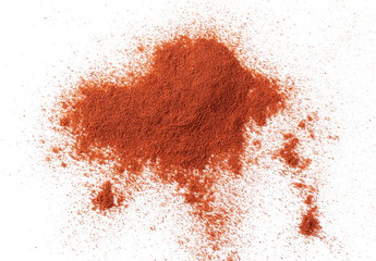 Pile of red paprika powder isolated on white background, top view