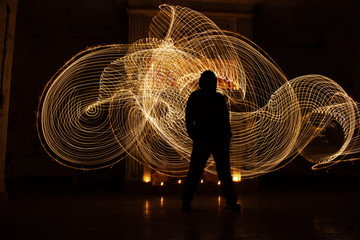 Human silhouette against backlight. Light painting photography. - obrazy, fototapety, plakaty