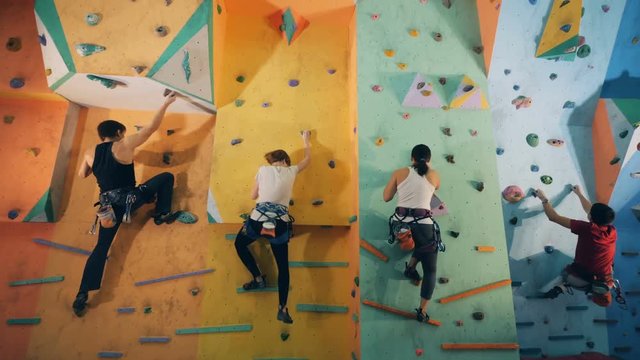 People on a wall in a training center, bottom view.