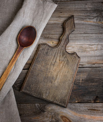 old brown wooden spoon and cutting board