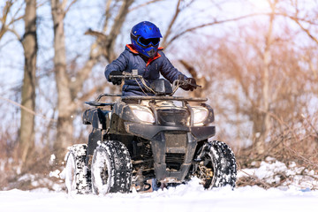 Travel in the winter on the ATV. Beautiful winter nature.