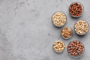 Assortment of nuts in glass bowls, top view