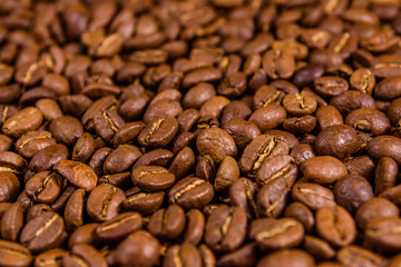Background of many roasted coffee beans. Selective focus