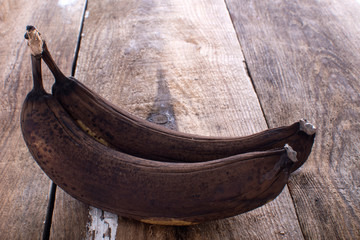 Ripe bananas on a wooden table