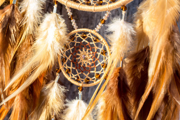 Handmade dream catcher with feathers threads and beads rope hanging - obrazy, fototapety, plakaty